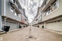 Attached garage parking with sectional doors - 