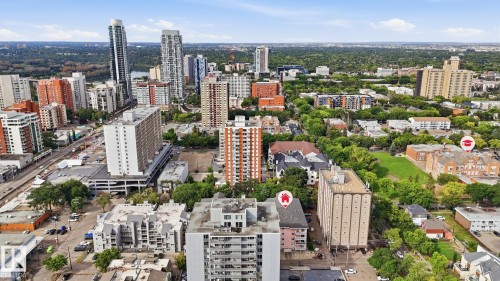 Aerial perspective of a dense urban environment with a variety of multi-story buildings and green spaces - #107 10153 117 St Nw, Edmonton, AB 