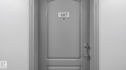 Paneled door with a polished chrome handle and a deadbolt - 