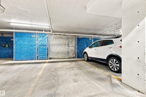 Concrete floor with yellow lane markings - #432 6703 172 St Nw, Edmonton, AB 