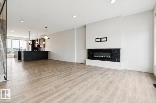 3290 Kulay Way Sw, Edmonton, AB - Indoor Photo Showing Living Room With Fireplace
