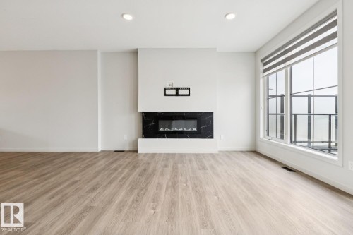 3290 Kulay Way Sw, Edmonton, AB - Indoor Photo Showing Living Room With Fireplace