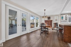 Hardwood-style flooring, white trim, recessed lighting, and a chandelier lighting fixture - 