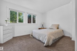 Bright interior with multiple windows, white trim, and light-colored walls - 
