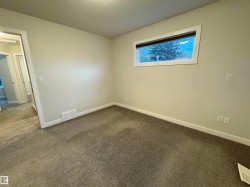 Wall-to-wall carpeting and white trim create a bright interior - 