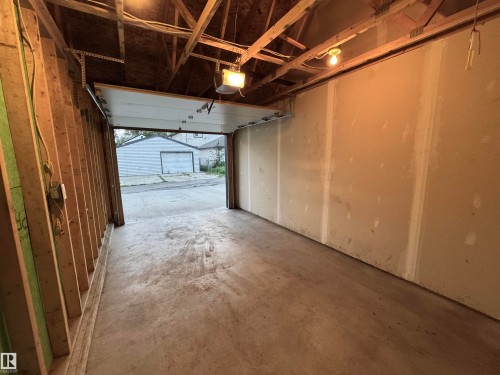 Concrete flooring with exposed wood framing and unfinished drywall - 12046 89 Street Nw, Edmonton, AB 