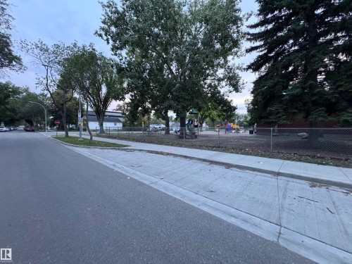 Paved asphalt street with concrete sidewalk and curb - 12046 89 Street Nw, Edmonton, AB 