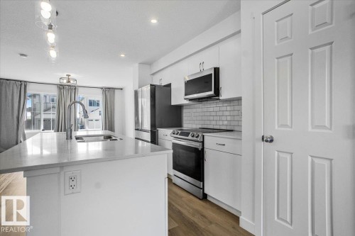 12 Elliot Wynd, Fort Saskatchewan, AB - Indoor Photo Showing Kitchen With Double Sink With Upgraded Kitchen