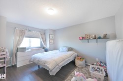 Recessed lighting, wood-finish flooring, and window treatments - 