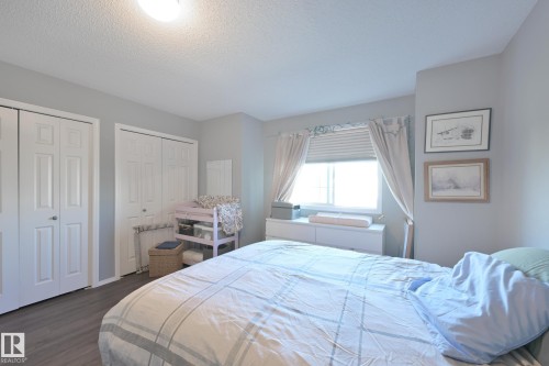 Gray wood-finish flooring - 8127 7 Avenue Sw, Edmonton, AB 