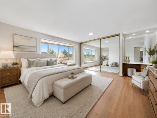 Wood-finish flooring throughout, featuring a large bay window with an integrated window seat, mirrored closet doors, and recessed lighting - 8008 158 Avenue Nw, Edmonton, AB - Indoor Photo Showing Bedroom