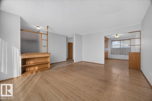 Wood-finish flooring throughout - 6104 92 Avenue Nw, Edmonton, AB 