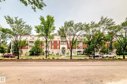 Multi-story building featuring a red brick and light-colored stone facade with multiple balconies - #307 1003 Gault Bv Nw, Edmonton, AB - Outdoor