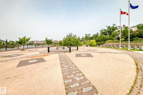Expansive paved walkway with decorative inlays and brick accents - #307 1003 Gault Bv Nw, Edmonton, AB - Outdoor