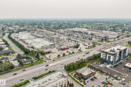 Extensive commercial development and residential areas surrounding a multi-lane roadway - #307 1003 Gault Bv Nw, Edmonton, AB -  With View