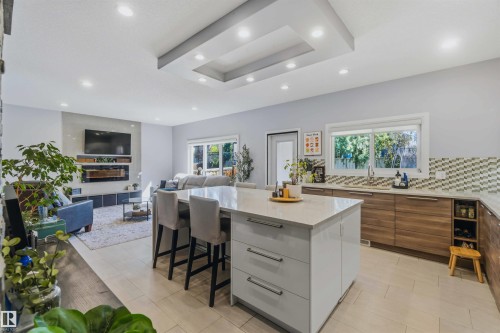 Recessed lighting and a tray ceiling illuminate the open-concept space - 7 Etoile Cres, St. Albert, AB 
