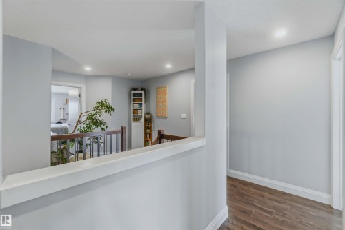 Light gray wall color, wood-finish flooring, recessed ceiling lighting, and white trim accents - 7 Etoile Cres, St. Albert, AB 