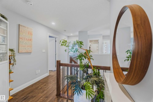 Wood-finish flooring with white trim - 7 Etoile Cres, St. Albert, AB 