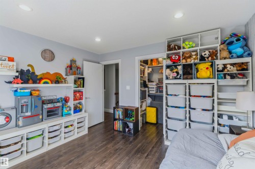 Wood-finish flooring with a neutral wall color - 7 Etoile Cres, St. Albert, AB 