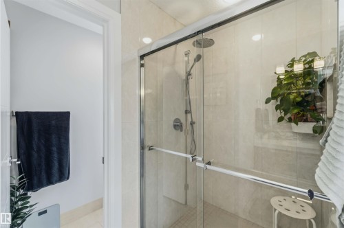 Shower enclosure with a rain shower head and handheld shower fixture - 7 Etoile Cres, St. Albert, AB 