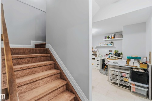 Carpeted staircase with wood-finish handrail - 7 Etoile Cres, St. Albert, AB 