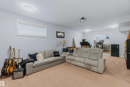 Carpeted floor, light-colored walls, recessed lighting, and a large window - 7 Etoile Cres, St. Albert, AB 
