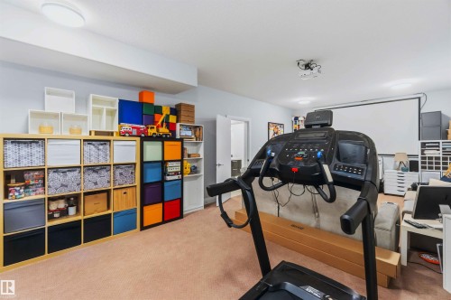 Recessed lighting and ceiling-mounted projector with a large screen - 7 Etoile Cres, St. Albert, AB 