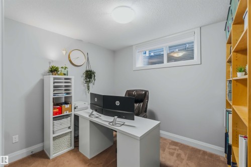Recessed ceiling light, neutral wall paint, white trim, single window, and built-in shelving - 7 Etoile Cres, St. Albert, AB 