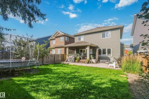 Expansive green lawn with a paver patio and a covered outdoor living area - 7 Etoile Cres, St. Albert, AB 