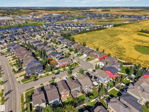 Established residential neighborhood featuring mature landscaping, paved streets, and a nearby pond - 7 Etoile Cres, St. Albert, AB 