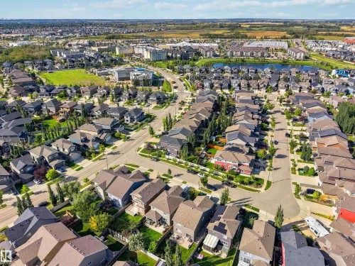 Expansive neighborhood featuring residential homes, a large body of water, green spaces, and commercial buildings - 7 Etoile Cres, St. Albert, AB 