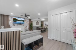 Wood-finish flooring throughout, complemented by recessed ceiling lighting - 