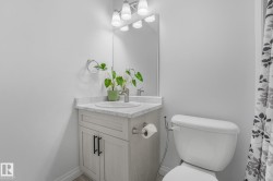 Single vanity with a white countertop and integrated sink, chrome faucet, and a wall-mounted mirror - 