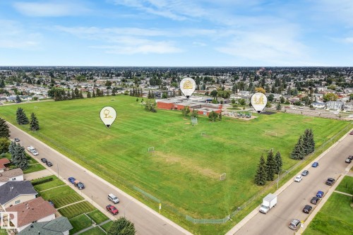 Expansive green space bordered by residential streets and mature trees - 12843 67 Street Nw, Edmonton, AB 