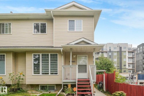 Two-story residence featuring light-colored horizontal siding and white trim - 12843 67 Street Nw, Edmonton, AB 