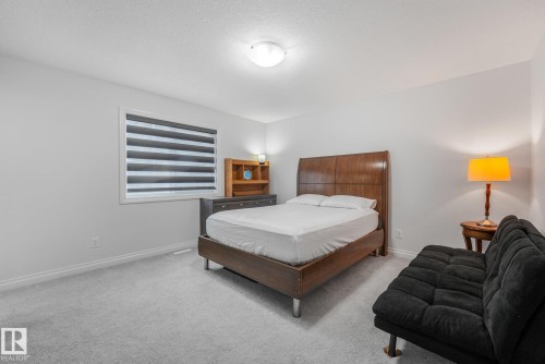 Light gray wall paint, gray carpeting, window with blinds, and ceiling-mounted light fixture - 12843 67 Street Nw, Edmonton, AB 
