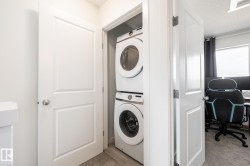 Dedicated laundry closet with stacked washer and dryer unit - 