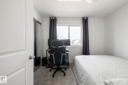 Single window with dark draperies, light grey carpet, and a white interior door - 