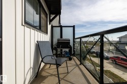 Balcony with glass panel railing and concrete flooring - 