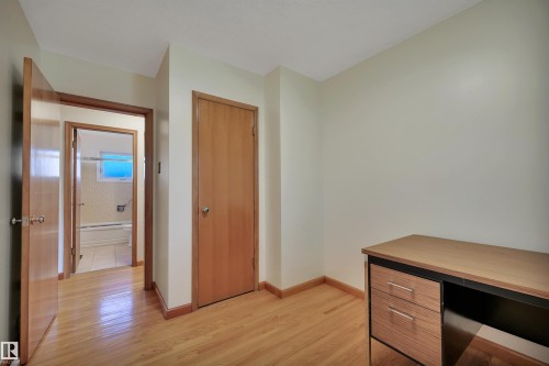 Hardwood flooring with natural wood trim and solid wood doors - 13416 102 Street Nw, Edmonton, AB 