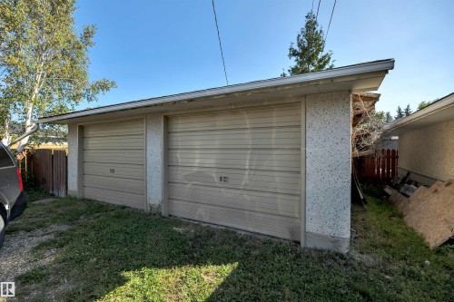 Detached two-door garage with textured exterior walls and a shingle roof - 13416 102 Street Nw, Edmonton, AB 