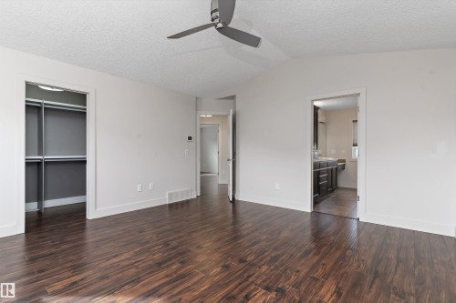Wood-finish flooring throughout, vaulted ceiling, and a ceiling fan - 17535 110 Street Nw, Edmonton, AB 