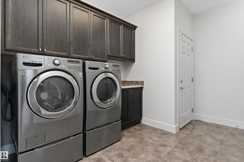 Built-in cabinetry, tile flooring, and a paneled door - 17535 110 Street Nw, Edmonton, AB 
