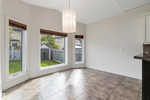 Ceramic tile flooring, multiple windows, and a built-in storage shed in the backyard - 17535 110 Street Nw, Edmonton, AB 