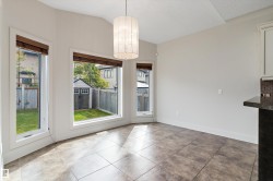 Ceramic tile flooring, multiple windows, and a built-in storage shed in the backyard - 