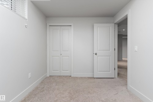Neutral tone wall finishes, carpeting, and white trim - 17535 110 Street Nw, Edmonton, AB 