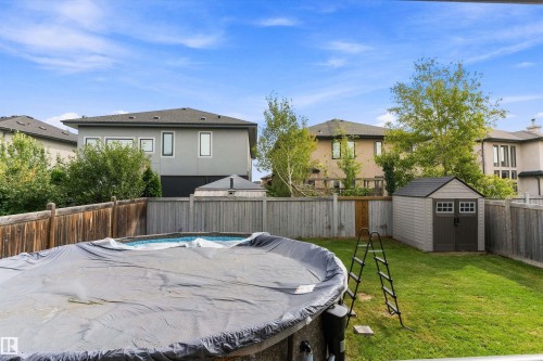 Above-ground swimming pool, privacy fencing, storage shed, and a ladder - 17535 110 Street Nw, Edmonton, AB 