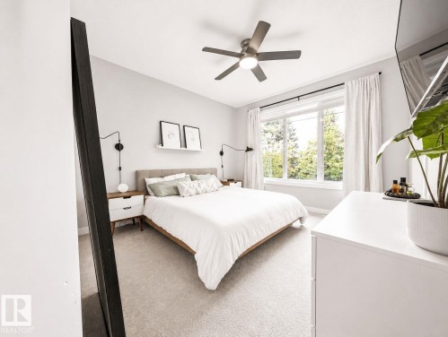 Recessed lighting, ceiling fan, expansive window, neutral wall paint, and light-toned carpet - 10516 76 Street Nw, Edmonton, AB 