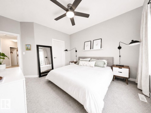 Vaulted ceiling with a contemporary ceiling fan and light fixture - 10516 76 Street Nw, Edmonton, AB 