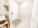White paneled door with smart lock entry - 10516 76 Street Nw, Edmonton, AB 